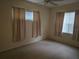 Bedroom with windows and carpet at 3292 Dow Ln, Spring Hill, FL 34609