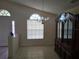 Open dining room features tiled flooring, natural light and a decorative china cabinet at 3292 Dow Ln, Spring Hill, FL 34609