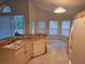 Bright kitchen featuring white appliances, breakfast bar and breakfast nook area at 3292 Dow Ln, Spring Hill, FL 34609