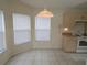 Cozy breakfast nook area with tiled floors located off of the kitchen at 3292 Dow Ln, Spring Hill, FL 34609