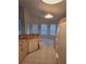 Bright eat-in kitchen with tile floors, white appliances, and a view of the backyard at 3292 Dow Ln, Spring Hill, FL 34609