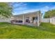 Spacious backyard with a covered patio, perfect for outdoor living at 3412 Trapnell Ridge Dr, Plant City, FL 33567