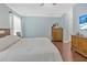 Relaxing bedroom retreat with wood flooring and beach themed decor at 3412 Trapnell Ridge Dr, Plant City, FL 33567