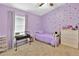 Whimsical bedroom features a confetti wall, plush toys, and soft lavender accents at 3412 Trapnell Ridge Dr, Plant City, FL 33567