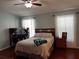 Calm bedroom with warm tones, a comfortable bed, and ample sunlight at 3412 Trapnell Ridge Dr, Plant City, FL 33567