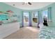 Bright bedroom with natural light, a ceiling fan, and stylish blue-purple ombre curtains at 3412 Trapnell Ridge Dr, Plant City, FL 33567
