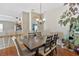 Formal dining room with wood floors, neutral walls, and designer light fixtures at 3412 Trapnell Ridge Dr, Plant City, FL 33567