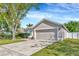 Well-kept home with a spacious driveway and manicured landscaping at 3412 Trapnell Ridge Dr, Plant City, FL 33567