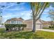 Attractive single-story home with a well-maintained lawn and mature tree at 3412 Trapnell Ridge Dr, Plant City, FL 33567