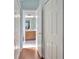 Hallway with closet that leads to the bathroom at 3412 Trapnell Ridge Dr, Plant City, FL 33567