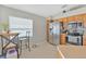 Well-lit kitchen with stainless steel appliances, wooden cabinets, and a view of the window with blinds at 3412 Trapnell Ridge Dr, Plant City, FL 33567