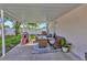 Covered patio with outdoor furniture and view of the backyard at 3412 Trapnell Ridge Dr, Plant City, FL 33567
