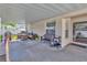 Covered patio with outdoor furniture, a bench and ' play accessories at 3412 Trapnell Ridge Dr, Plant City, FL 33567