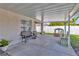 Covered patio with outdoor furniture and view of the backyard and fence at 3412 Trapnell Ridge Dr, Plant City, FL 33567