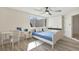 Well-lit bedroom with built-in closets, wood-look floors, and a matching desk and nightstand set at 3455 Overland Dr, Holiday, FL 34691