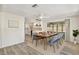 Elegant dining room adjacent to the modern kitchen, perfect for Gathering meals and entertaining guests at 3455 Overland Dr, Holiday, FL 34691