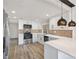 Well-appointed kitchen featuring stainless steel appliances and a convenient breakfast bar at 3455 Overland Dr, Holiday, FL 34691