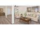 Cozy living room featuring neutral tones, a comfortable sofa, and a large window at 3455 Overland Dr, Holiday, FL 34691