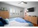 Bright bedroom featuring hardwood floors, plantation shutters, and neutral decor at 3617 Horatio St, Tampa, FL 33609