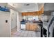 Well-lit kitchen featuring ample cabinet space, modern appliances, and a view to another room at 3970 La Costa Ln, Largo, FL 33771