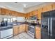 Bright kitchen featuring ample cabinet space, modern appliances, and a convenient layout at 3970 La Costa Ln, Largo, FL 33771