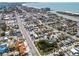 Aerial view of the neighborhood showcasing the home's location in relation to beaches, businesses, and roadways at 427 79Th Ave, St Pete Beach, FL 33706