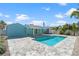 Inviting backyard showcasing a sparkling pool and a spacious patio area, perfect for outdoor enjoyment at 427 79Th Ave, St Pete Beach, FL 33706