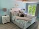 Cozy bedroom with a white bed and gray accents at 427 79Th Ave, St Pete Beach, FL 33706
