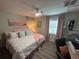 Charming bedroom with a plush bed and soft pink accents at 427 79Th Ave, St Pete Beach, FL 33706