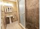 Bathroom featuring a glass shower, tiled floor and vanity with storage at 514 Brandon Ave, Clearwater, FL 33765