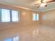 This bedroom features neutral walls, a ceiling fan, and tiled floors at 514 Brandon Ave, Clearwater, FL 33765