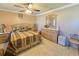 Bedroom featuring fan, seating, dresser and a bed with patterned bedding at 514 Brandon Ave, Clearwater, FL 33765