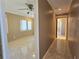 This bedroom features neutral walls, a ceiling fan, and tiled floors at 514 Brandon Ave, Clearwater, FL 33765