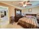 Bedroom with dresser, ceiling fan and door that opens to another living space at 514 Brandon Ave, Clearwater, FL 33765