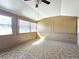 Enclosed porch with several large windows offering natural light and a ceiling fan at 514 Brandon Ave, Clearwater, FL 33765