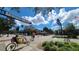 Lively downtown market scene with people, shops, and the 'Dunedin Downtown Market' sign overhead at 514 Brandon Ave, Clearwater, FL 33765