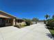Exterior view showcasing a long driveway, landscaping, and manicured lawn at 514 Brandon Ave, Clearwater, FL 33765