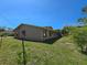 The exterior showing the side of the home with a well-manicured lawn at 514 Brandon Ave, Clearwater, FL 33765