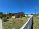 The exterior showcasing landscaping around the yard with a new fence at 514 Brandon Ave, Clearwater, FL 33765