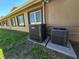 Exterior view with two Goodman air conditioners and the windows along the wall at 514 Brandon Ave, Clearwater, FL 33765