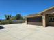 View of the garage and driveway featuring a well maintained exterior and landscaping at 514 Brandon Ave, Clearwater, FL 33765