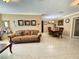 Open-concept living room and dining area with neutral tones and tile flooring at 514 Brandon Ave, Clearwater, FL 33765