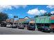 Charming street view of local businesses in a town, with colorful facades and parked cars at 514 Brandon Ave, Clearwater, FL 33765