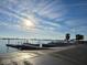 Boat ramp with docks, a waterfront view, and a clear sky at 514 Brandon Ave, Clearwater, FL 33765