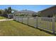 Property featuring a well-maintained white picket fence and lush green lawn at 514 Brandon Ave, Clearwater, FL 33765