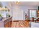 Bright foyer with hardwood floors, a double door entry, and decorative accents at 5916 Tulip Flower Dr, Riverview, FL 33578