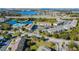 Extensive aerial view of the community with multiple housing units, community pool, and convenient highway access at 6447 Cypressdale Dr # 202, Riverview, FL 33578