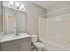 Bathroom featuring a tub, toilet, and vanity with storage at 6447 Cypressdale Dr # 202, Riverview, FL 33578