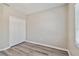 Bedroom featuring wood-look floors and a double-door closet at 6447 Cypressdale Dr # 202, Riverview, FL 33578