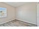 Bedroom featuring wood-look floors, a window, and a closet at 6447 Cypressdale Dr # 202, Riverview, FL 33578